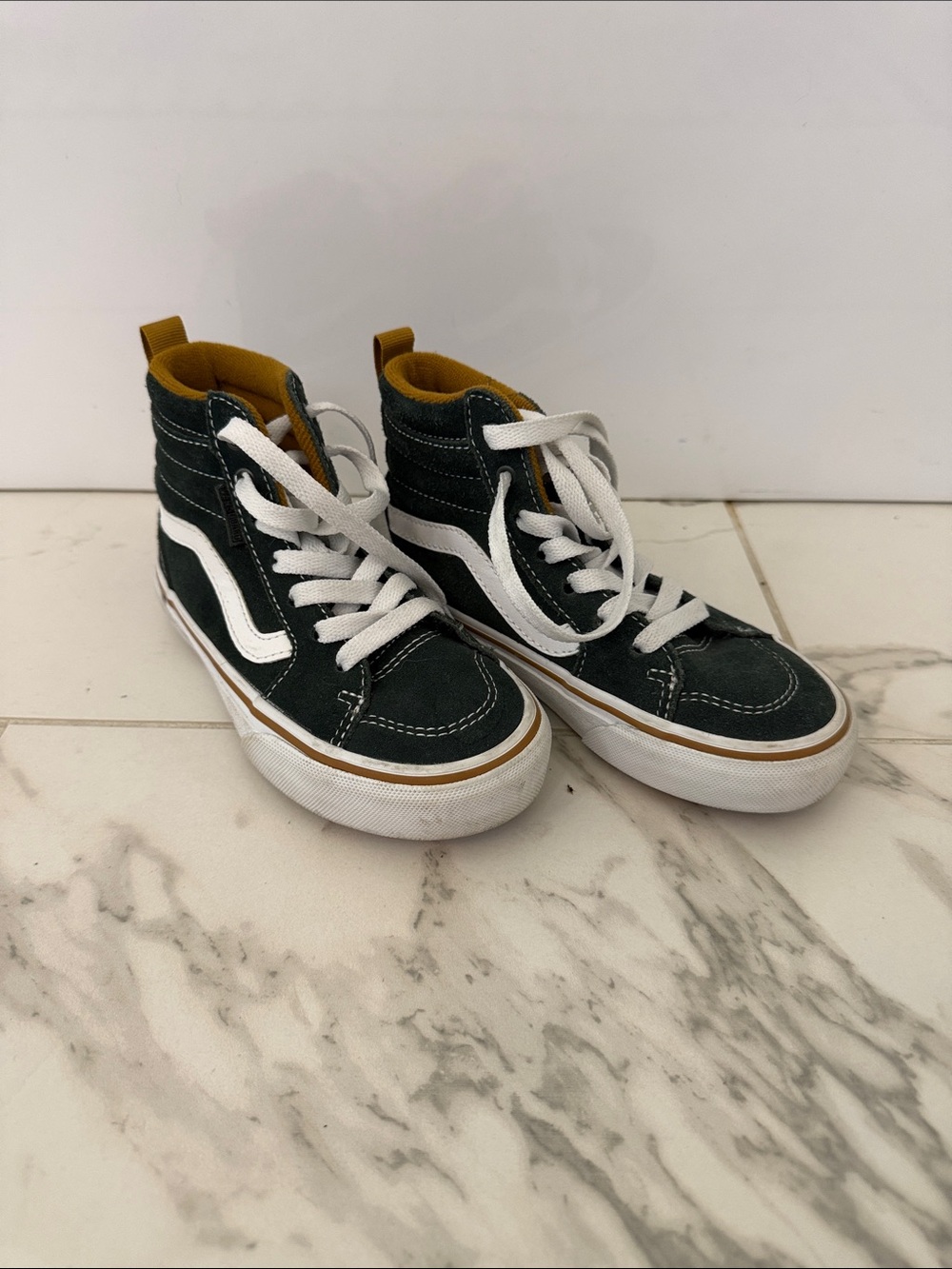 Black High-Top Sneakers with White Stripe and Mustard Interior